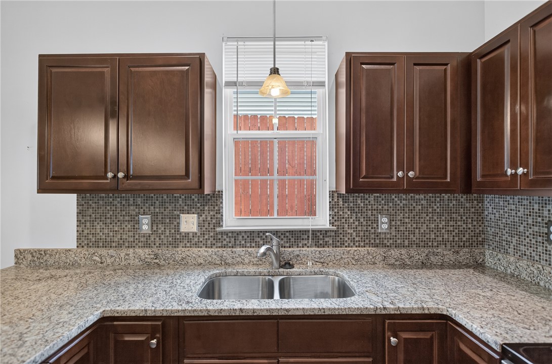 235 Pendleton Road, Unit K1 Clemson, SC 29631 - Photo 18 of 49 A well-appointed kitchen showcasing elegant granite countertops and rich cabinetry.