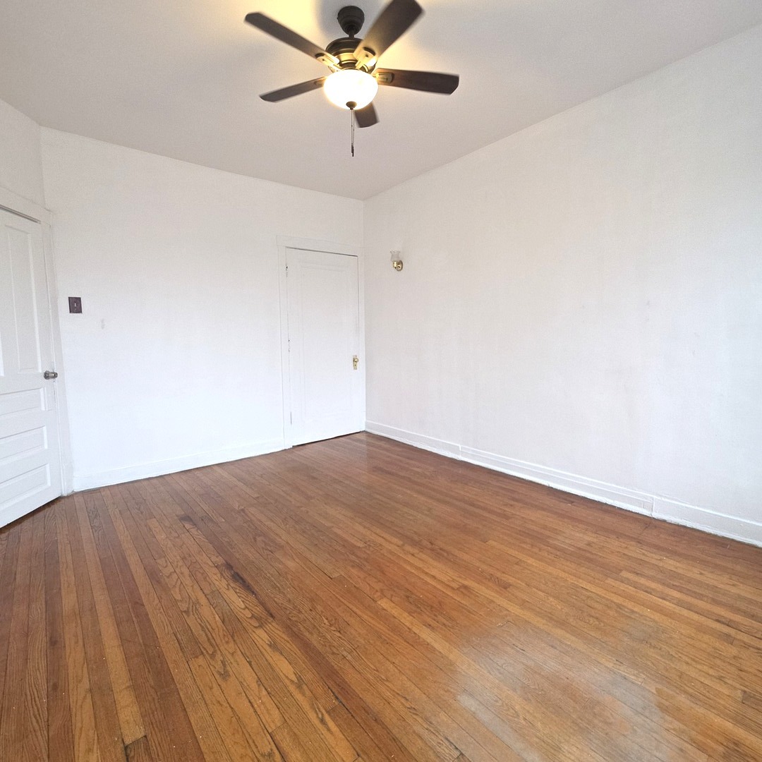 1248 North Spaulding Avenue, Unit 2 Chicago, IL 60651 - Photo 9 of 12 a view of empty room with wooden floor