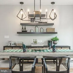 a kitchen with a table and chairs