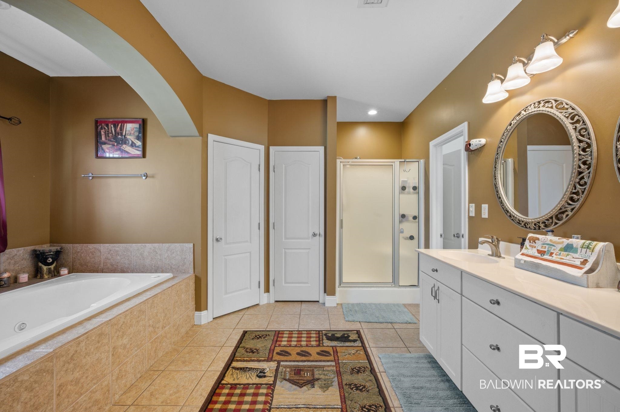 48513 Phillipsville Road Bay Minette, AL 36507 - Photo 24 of 50 Full bath featuring tile patterned flooring, a stall shower, vanity, and a bath