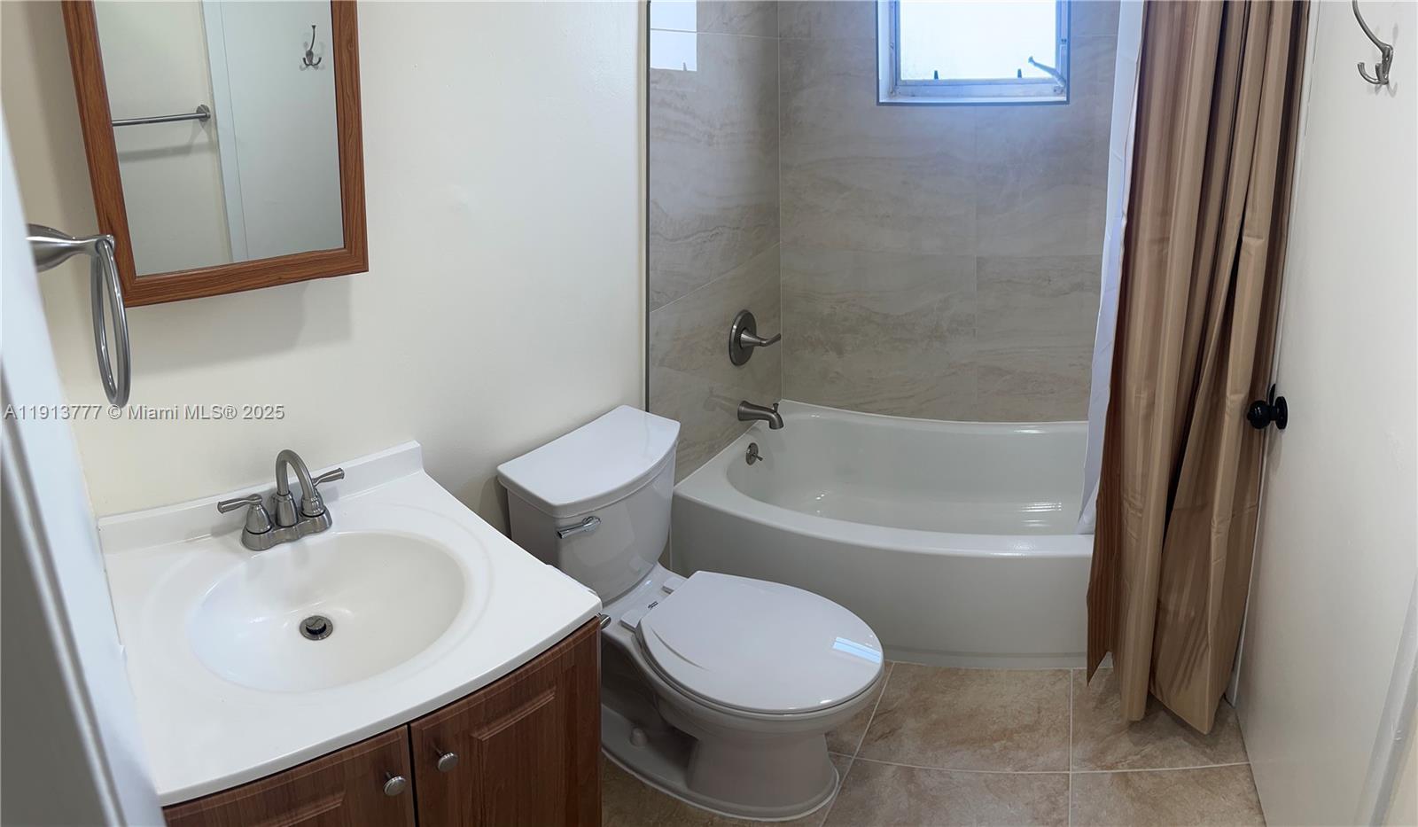 1051 Southwest 1st Street, Unit 404 Miami, FL 33130 - Photo 18 of 37 a bathroom with a sink toilet and bathtub