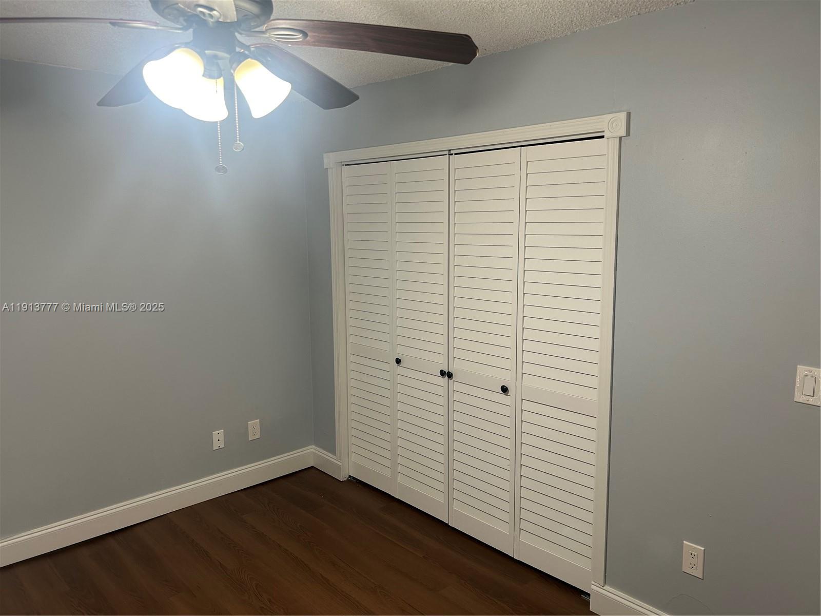 1051 Southwest 1st Street, Unit 404 Miami, FL 33130 - Photo 24 of 37 an empty room with wooden floor and windows