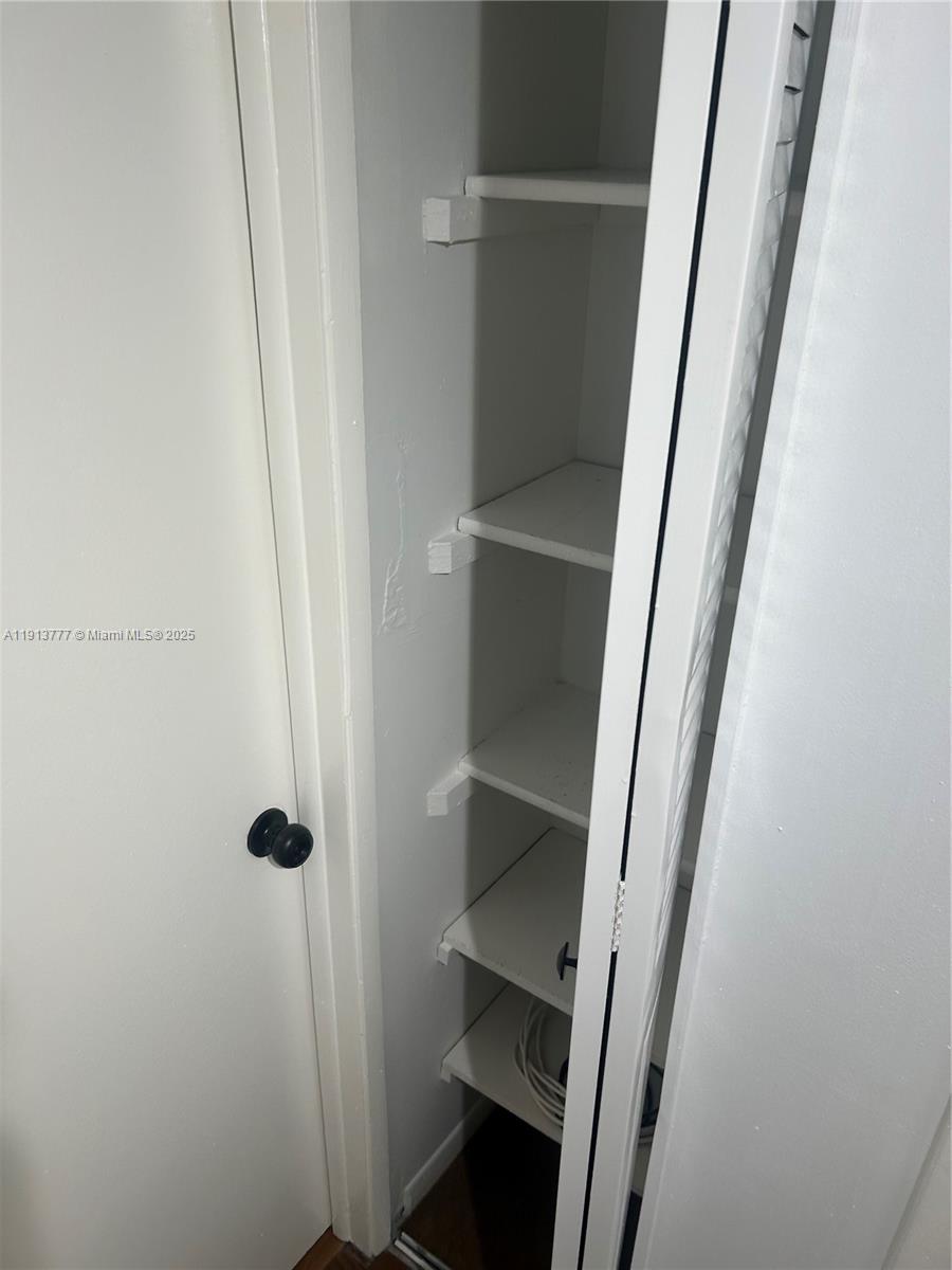 1051 Southwest 1st Street, Unit 404 Miami, FL 33130 - Photo 33 of 37 a bathroom with a sink