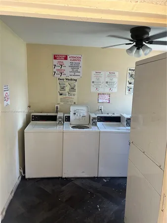 a living room with furniture and a lamp