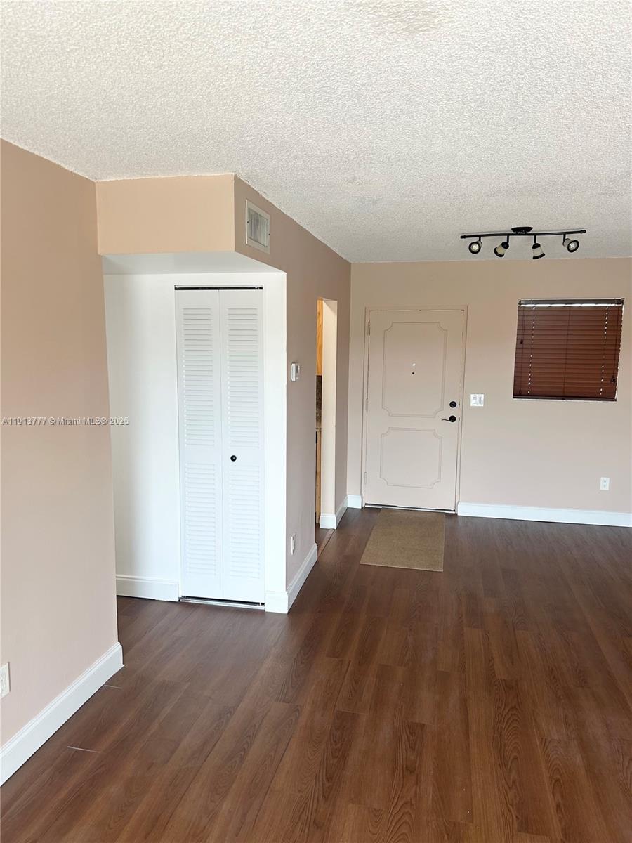 1051 Southwest 1st Street, Unit 404 Miami, FL 33130 - Photo 10 of 37 a view of a livingroom with wooden floor