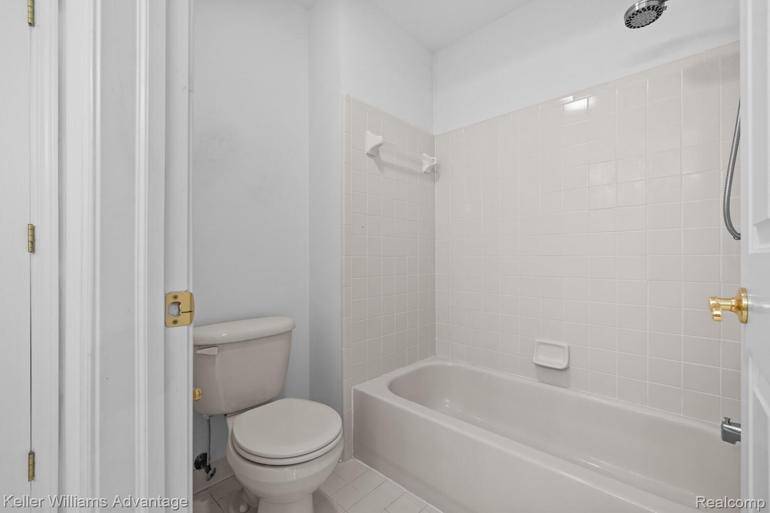 4100 Norwich Court Rochester, MI 48306 - Photo 46 of 72 Bathroom with light tile patterned floors and washtub / shower combination