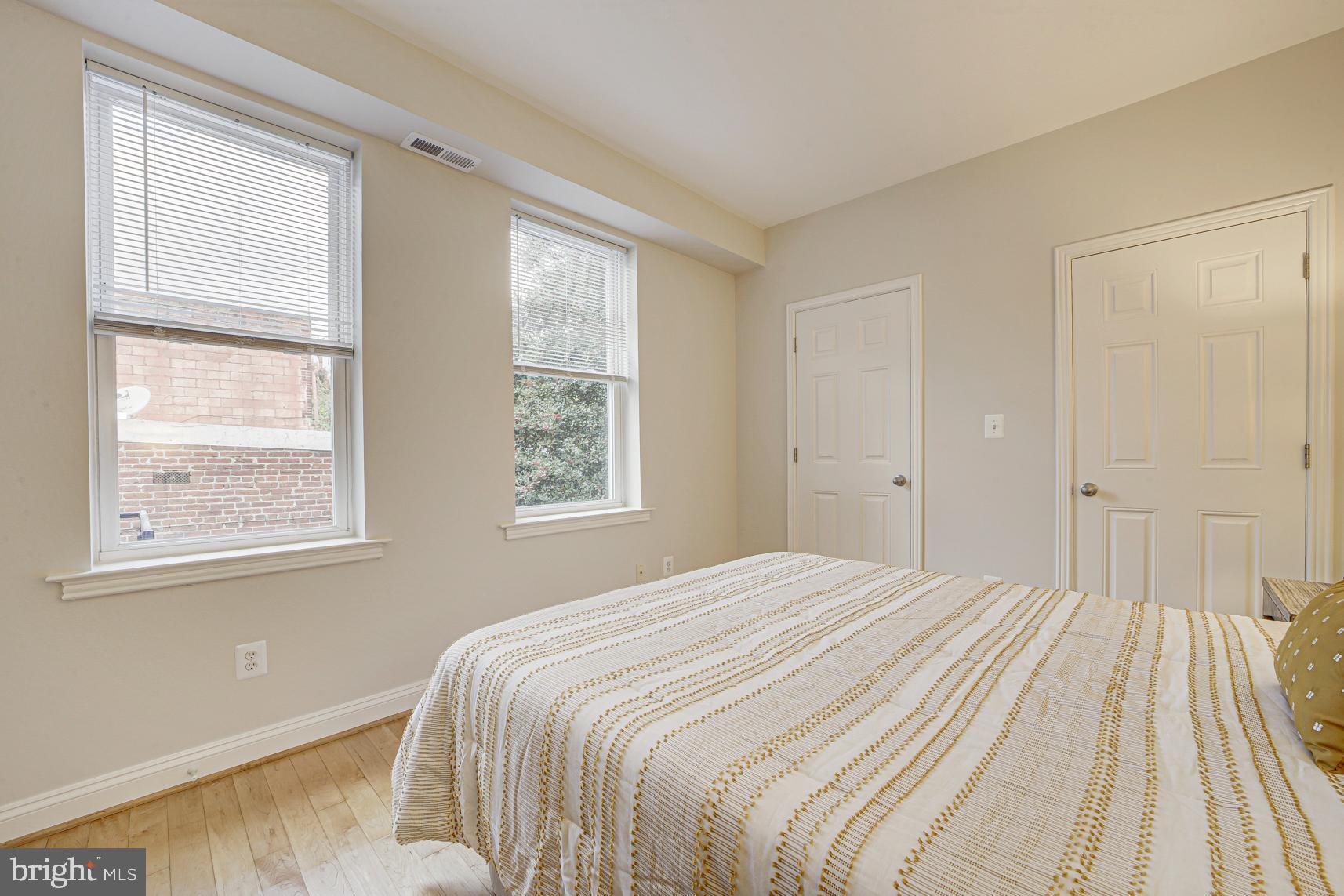220 13th Street Southeast, Unit 24 Washington, DC 20003 - Photo 16 of 27 a bedroom with a bed and a window