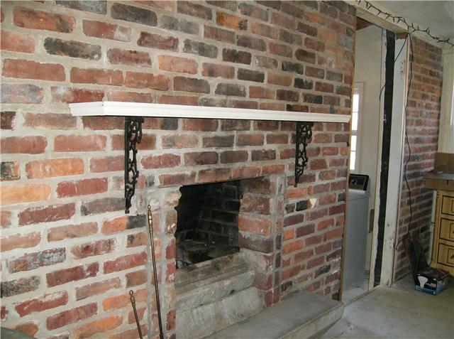 1246 Cochran Cemetery Road Lewisburg, TN 37091 - Photo 12 of 20 One whole wall in the Kitchen features a brick fireplace...the Kitchen is 19 x 17 and has room for a big country table in the center...there's a utility room (converted sun porch) just off the Kitchen...