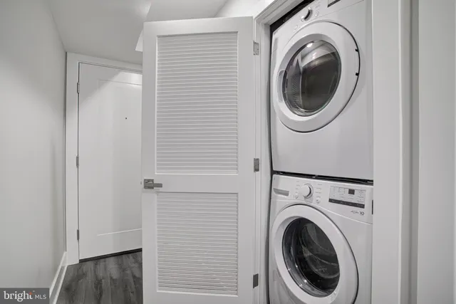 a view of a hallway with washer and dryer