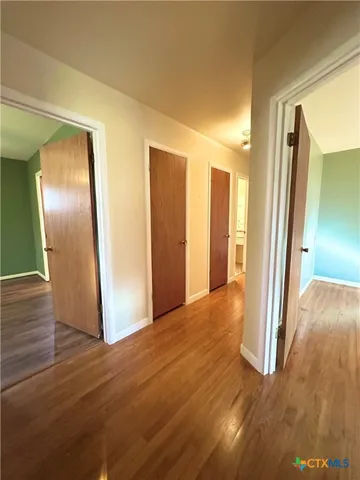 a view of entryway with wooden floor