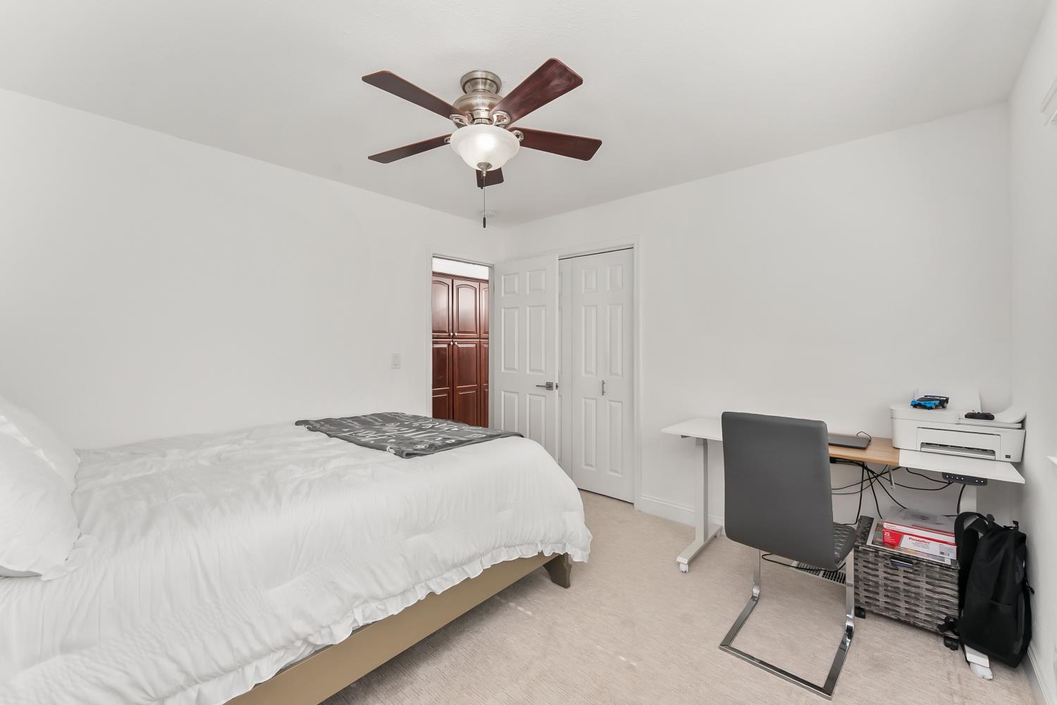 2801 Osborne Road Cameron Park, CA 95682 - Photo 14 of 37 a bedroom with a bed and a chandelier
