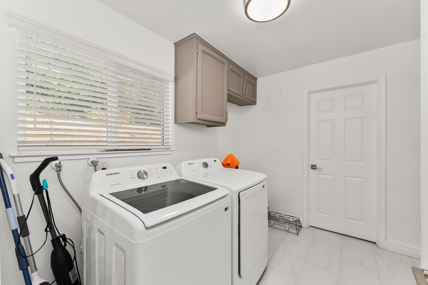 2801 Osborne Road Cameron Park, CA 95682 - Photo 19 of 37 a room with a sink a washer and dryer