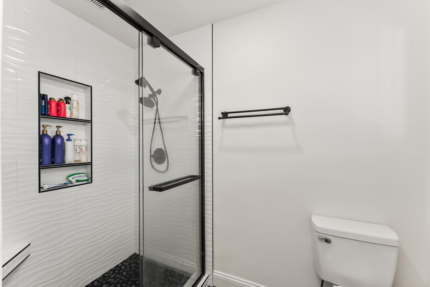 2801 Osborne Road Cameron Park, CA 95682 - Photo 21 of 37 a bathroom with a shower and a toilet