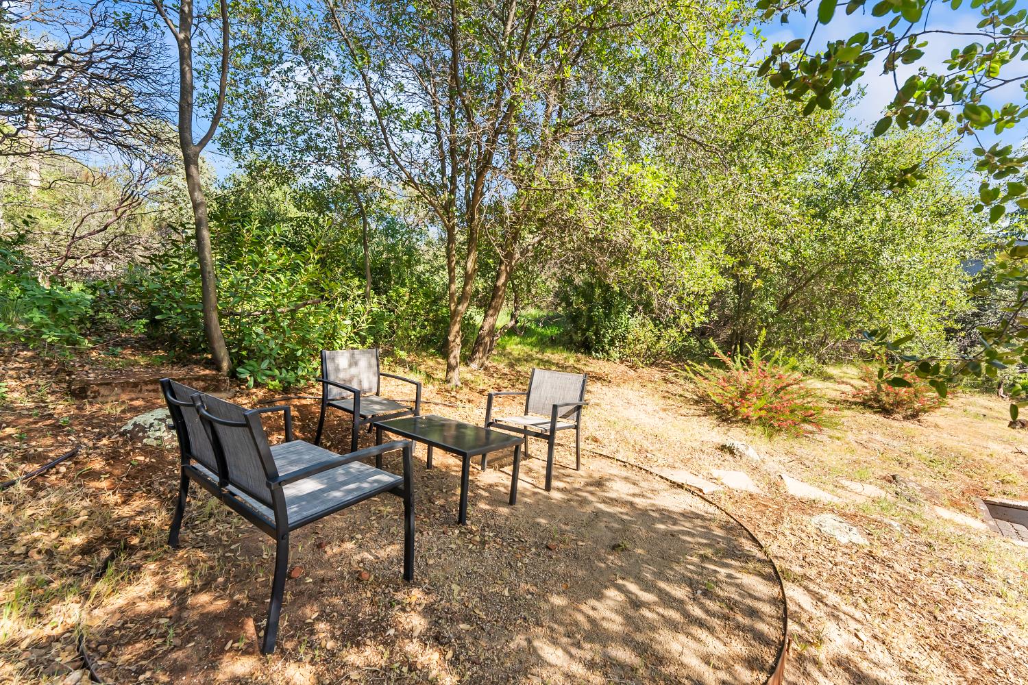 2801 Osborne Road Cameron Park, CA 95682 - Photo 24 of 37 a backyard of a house with table and chairs