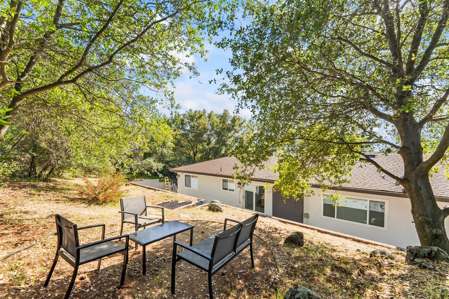 2801 Osborne Road Cameron Park, CA 95682 - Photo 26 of 37 a backyard of a house with table and chairs
