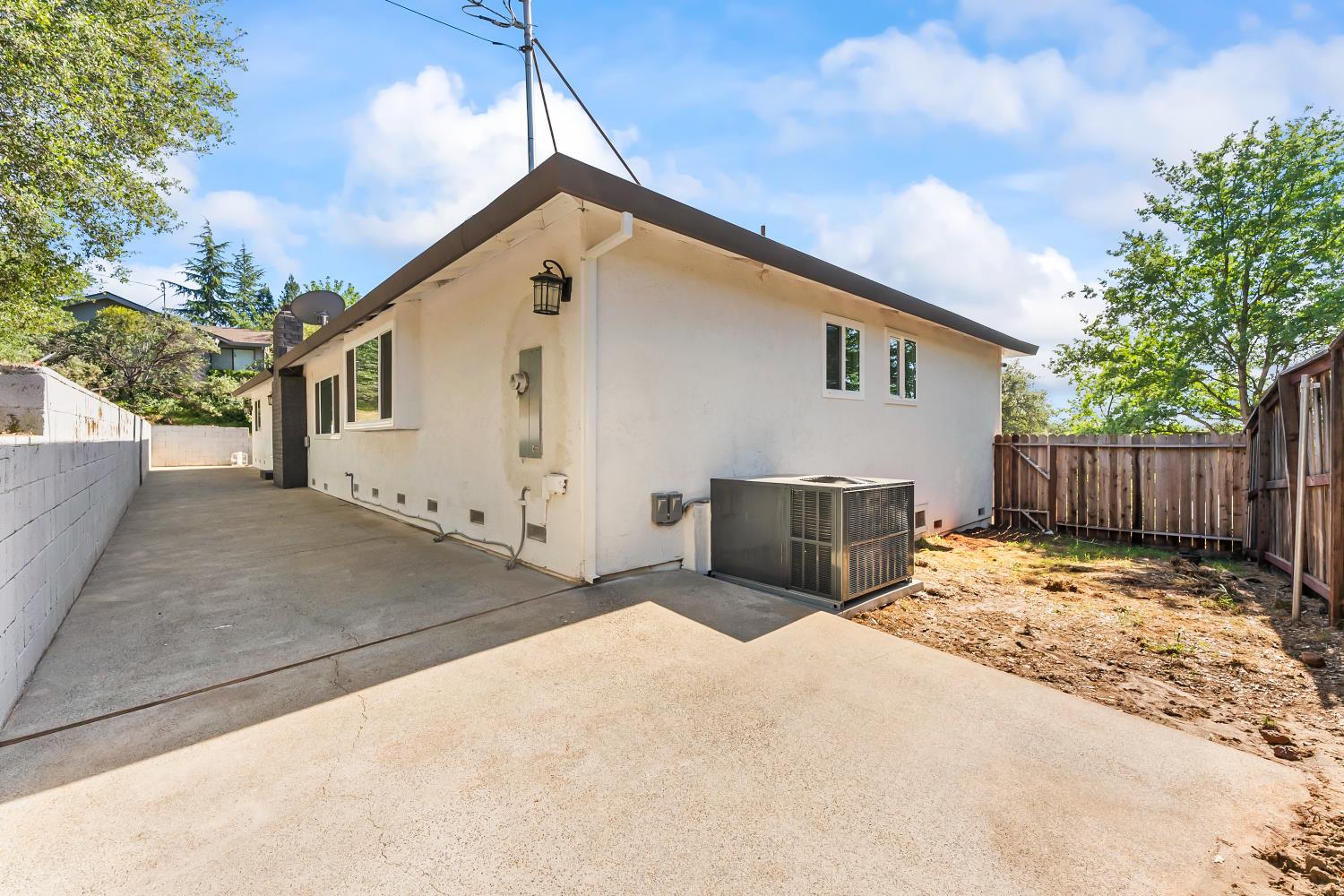 2801 Osborne Road Cameron Park, CA 95682 - Photo 33 of 37 a view of a house with wooden wall and roof