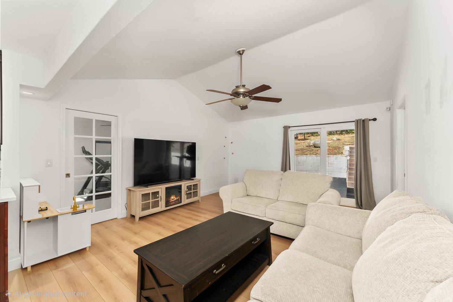 2801 Osborne Road Cameron Park, CA 95682 - Photo 8 of 37 a living room with furniture and a flat screen tv