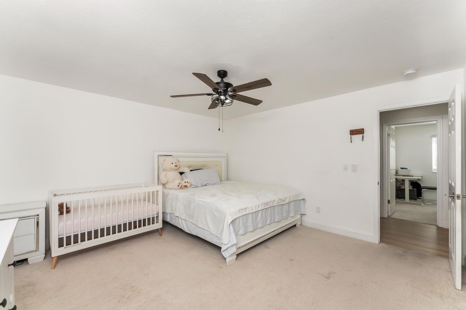 2801 Osborne Road Cameron Park, CA 95682 - Photo 10 of 37 a bed room with a bed and a ceiling fan