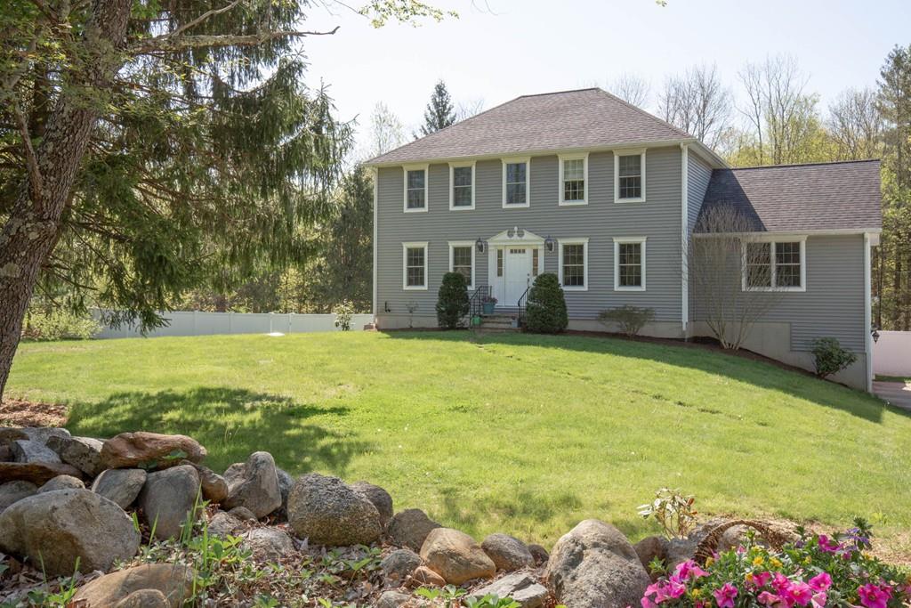 1079 North Brookfield Road Oakham, MA 01068 - Photo 1 of 40 a front view of house with yard and seating area