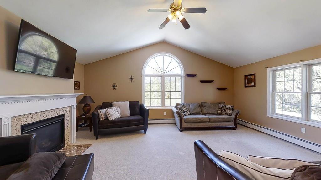 1079 North Brookfield Road Oakham, MA 01068 - Photo 14 of 40 a living room with furniture and a large window