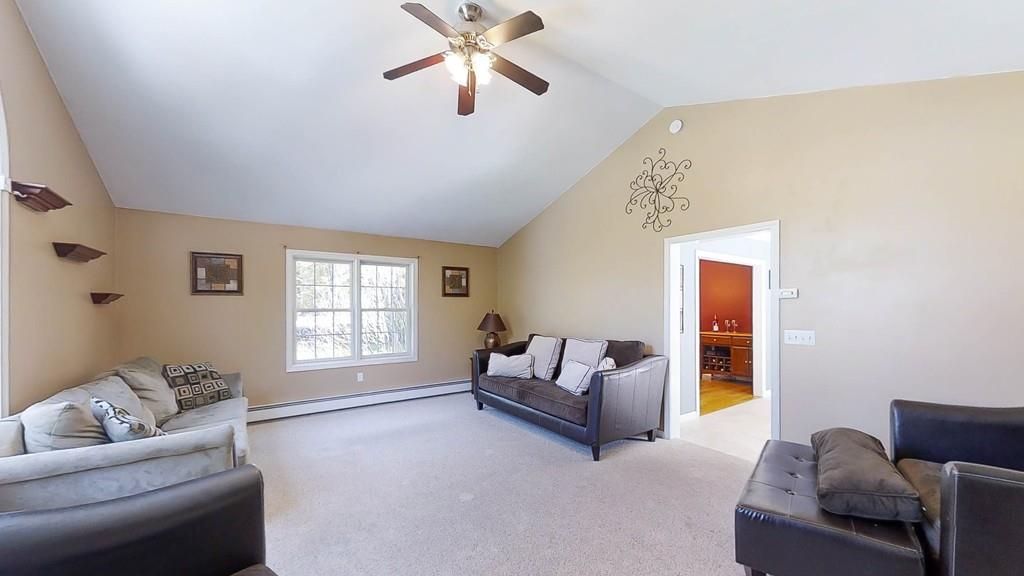 1079 North Brookfield Road Oakham, MA 01068 - Photo 15 of 40 a living room with furniture and a window
