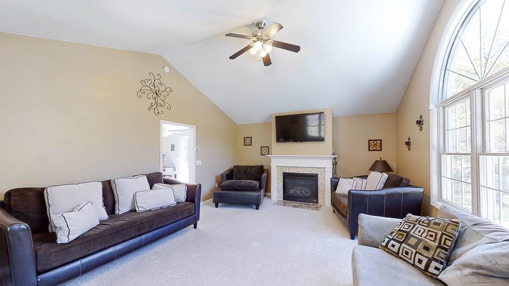 1079 North Brookfield Road Oakham, MA 01068 - Photo 17 of 40 a living room with furniture flat screen tv and a fireplace