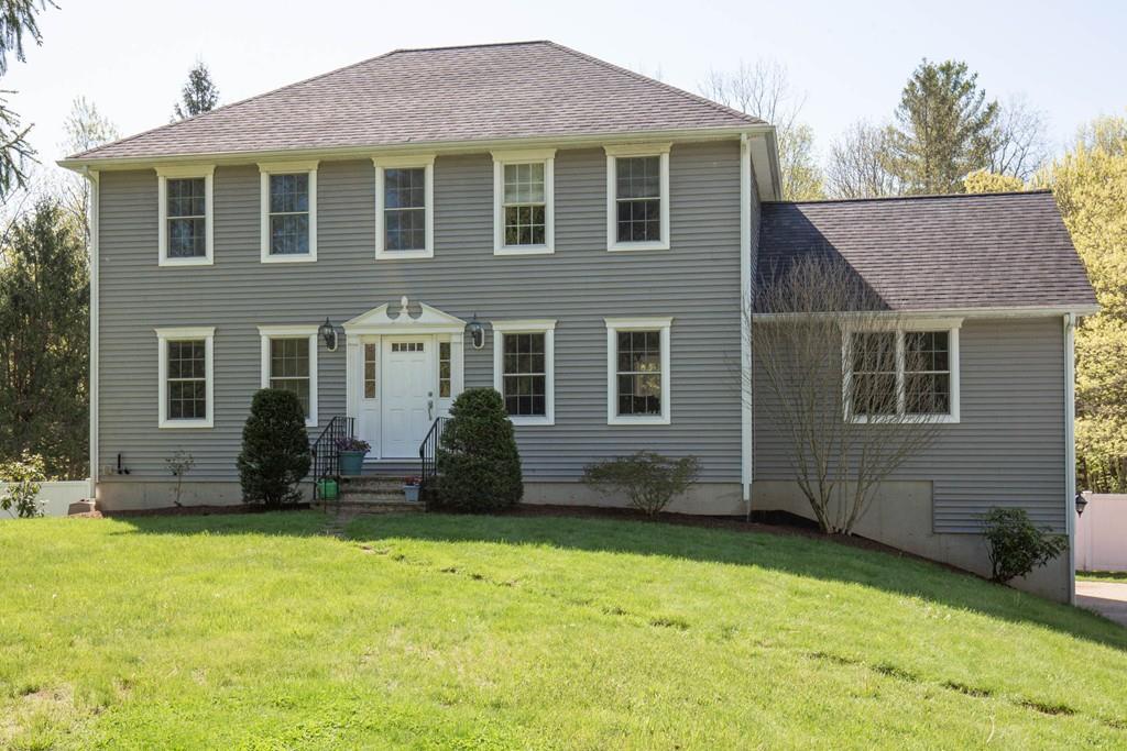 1079 North Brookfield Road Oakham, MA 01068 - Photo 2 of 40 a front view of a house with a yard