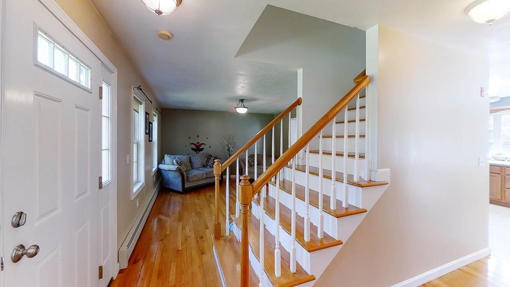 1079 North Brookfield Road Oakham, MA 01068 - Photo 21 of 40 a view of entryway and hall with wooden floor