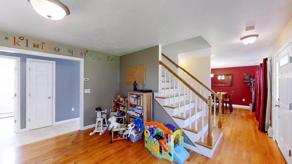 1079 North Brookfield Road Oakham, MA 01068 - Photo 22 of 40 a view of a livingroom with furniture and stairs