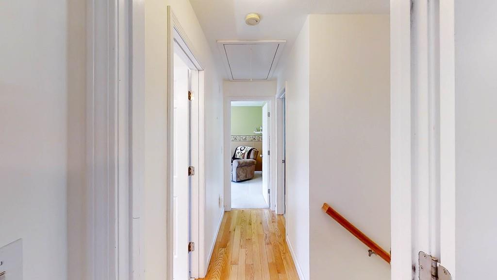 1079 North Brookfield Road Oakham, MA 01068 - Photo 24 of 40 a view of a hallway with a livingroom and a bathroom with a sink