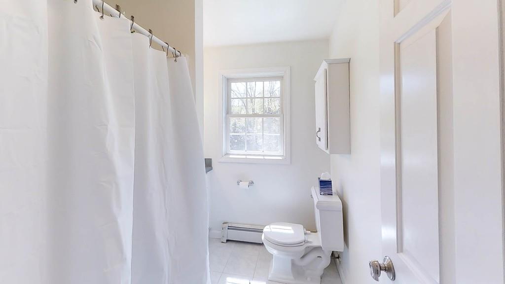 1079 North Brookfield Road Oakham, MA 01068 - Photo 28 of 40 a white toilet sitting next to a window