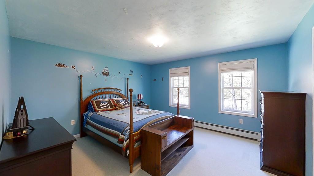 1079 North Brookfield Road Oakham, MA 01068 - Photo 29 of 40 a bedroom with a bed and a window