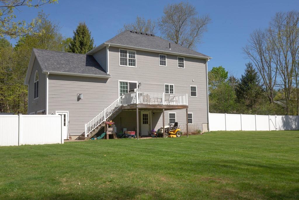 1079 North Brookfield Road Oakham, MA 01068 - Photo 3 of 40 a view of a house with a big yard