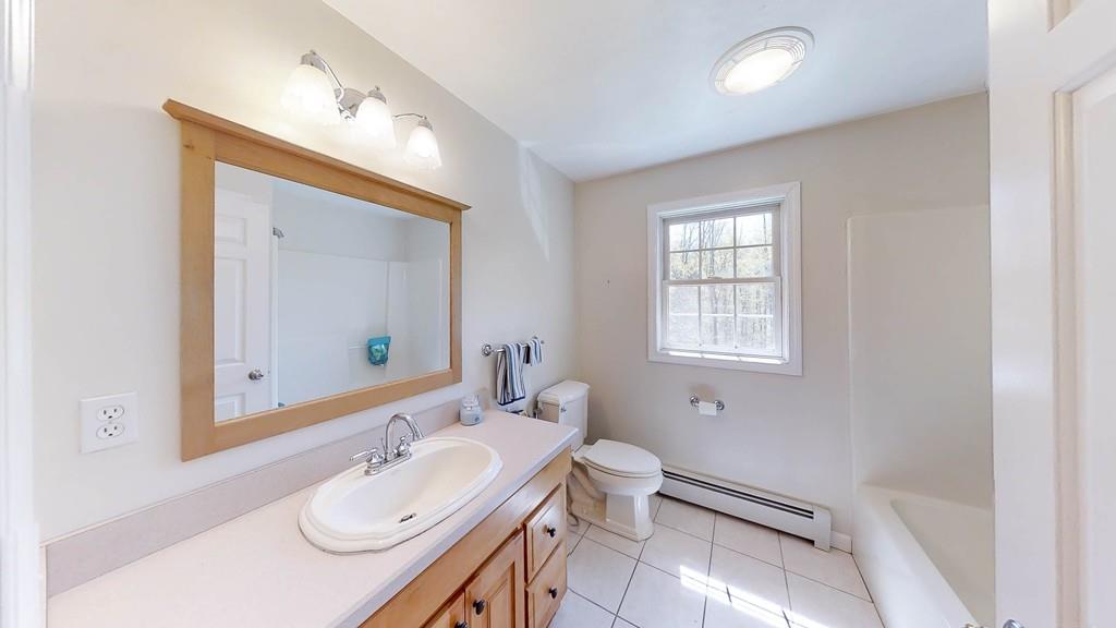 1079 North Brookfield Road Oakham, MA 01068 - Photo 31 of 40 a bathroom with a sink vanity granite toilet and mirror