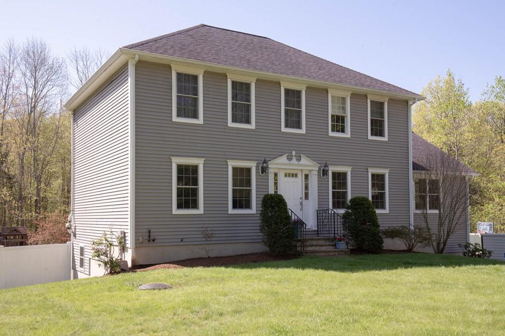 1079 North Brookfield Road Oakham, MA 01068 - Photo 33 of 40 a front view of a house with a yard