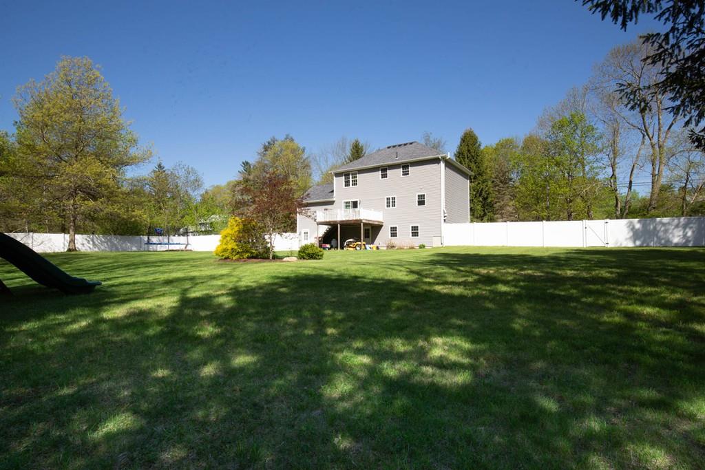 1079 North Brookfield Road Oakham, MA 01068 - Photo 34 of 40 a white house with a big yard and large trees