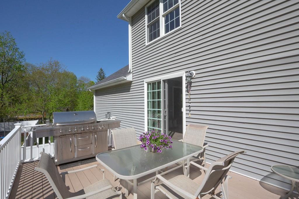 1079 North Brookfield Road Oakham, MA 01068 - Photo 39 of 40 a view of a patio with wooden furniture