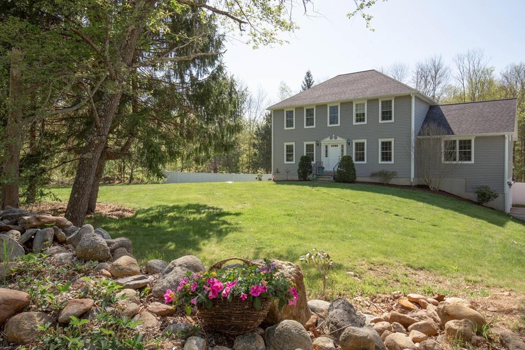 1079 North Brookfield Road Oakham, MA 01068 - Photo 40 of 40 a view of a house with a garden and pathway