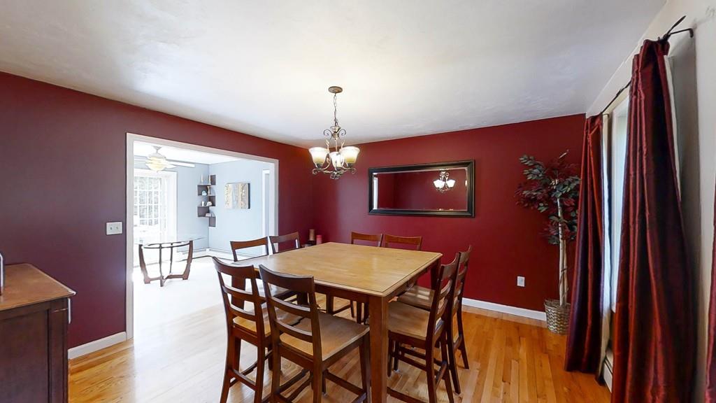 1079 North Brookfield Road Oakham, MA 01068 - Photo 6 of 40 a view of a dining room with furniture and chandelier