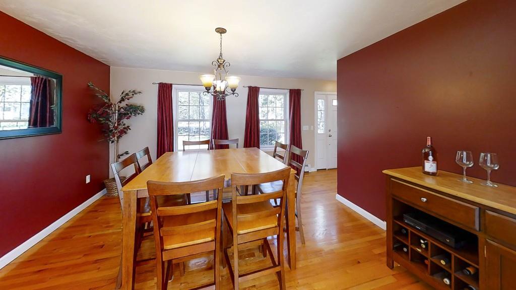 1079 North Brookfield Road Oakham, MA 01068 - Photo 7 of 40 a view of a dining room with furniture and chandelier