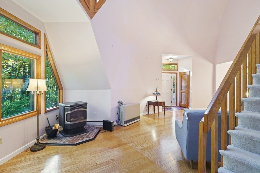 86 Brooks Station Road Princeton, MA 01541 - Photo 7 of 36 a view of a livingroom with furniture workspace window and hardwood floor