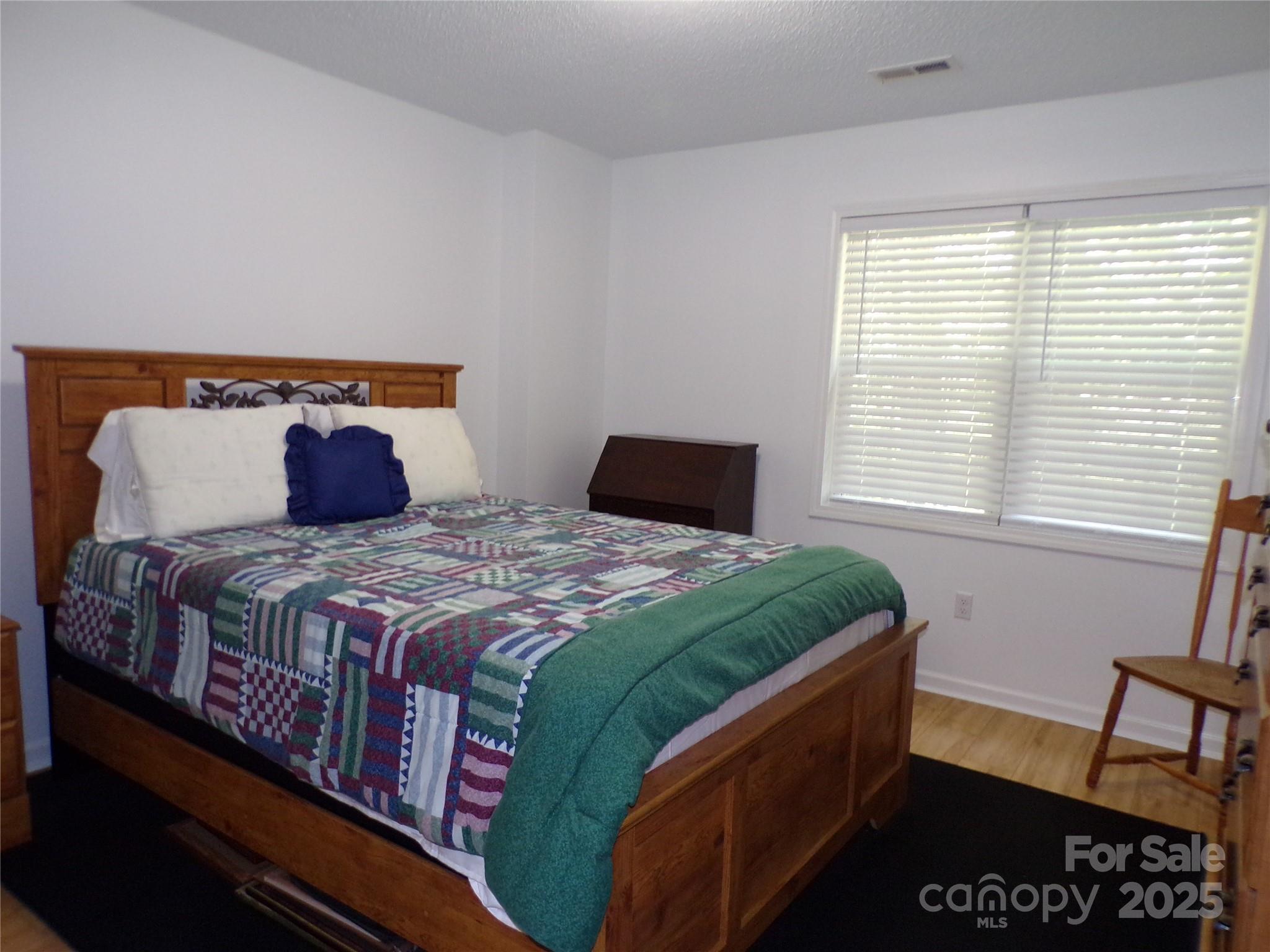 319 7th St Place Southwest, Unit E5 Conover, NC 28613 - Photo 12 of 15 a bedroom with a bed and a window