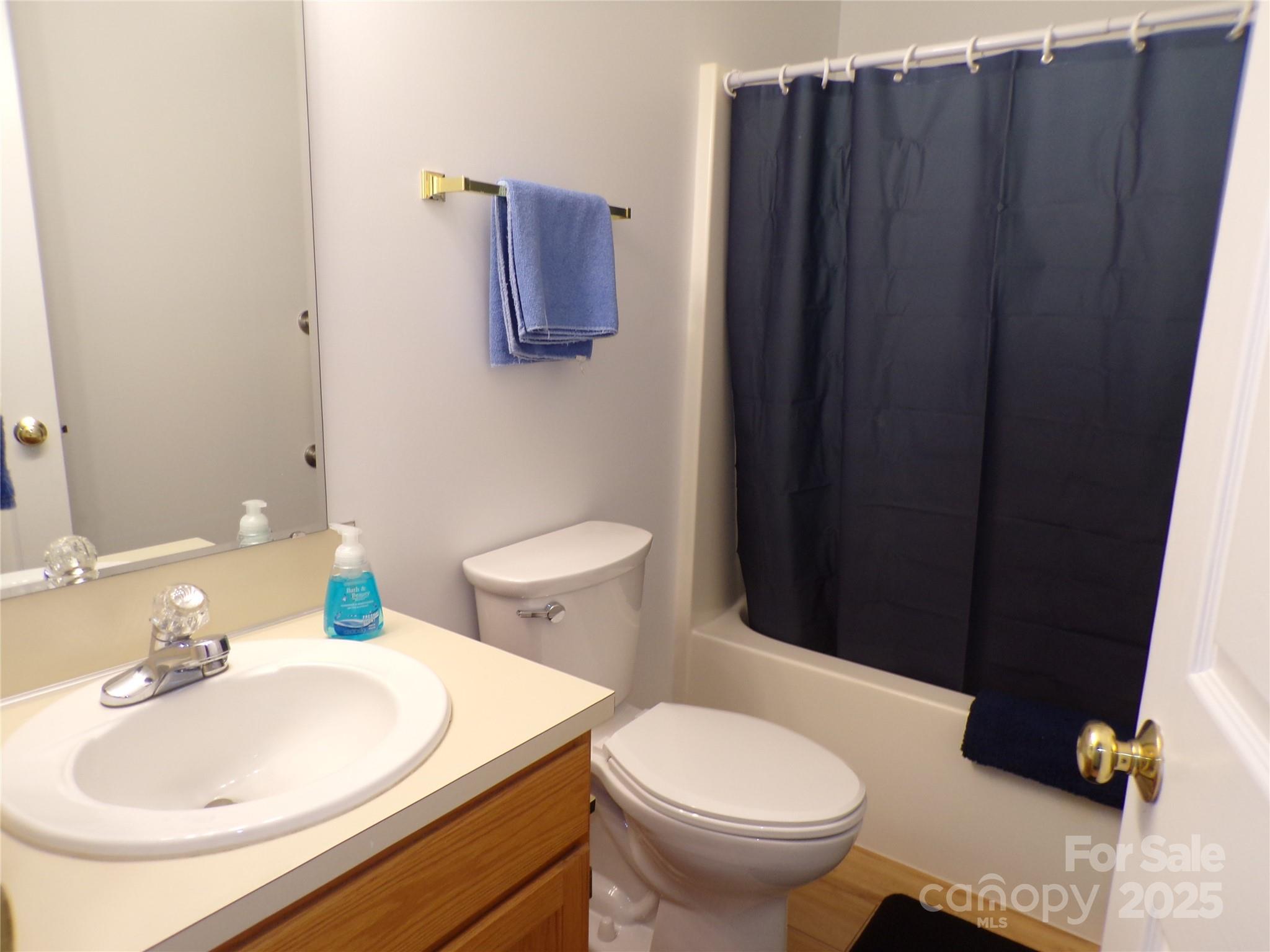 319 7th St Place Southwest, Unit E5 Conover, NC 28613 - Photo 13 of 15 a bathroom with a sink toilet and vanity