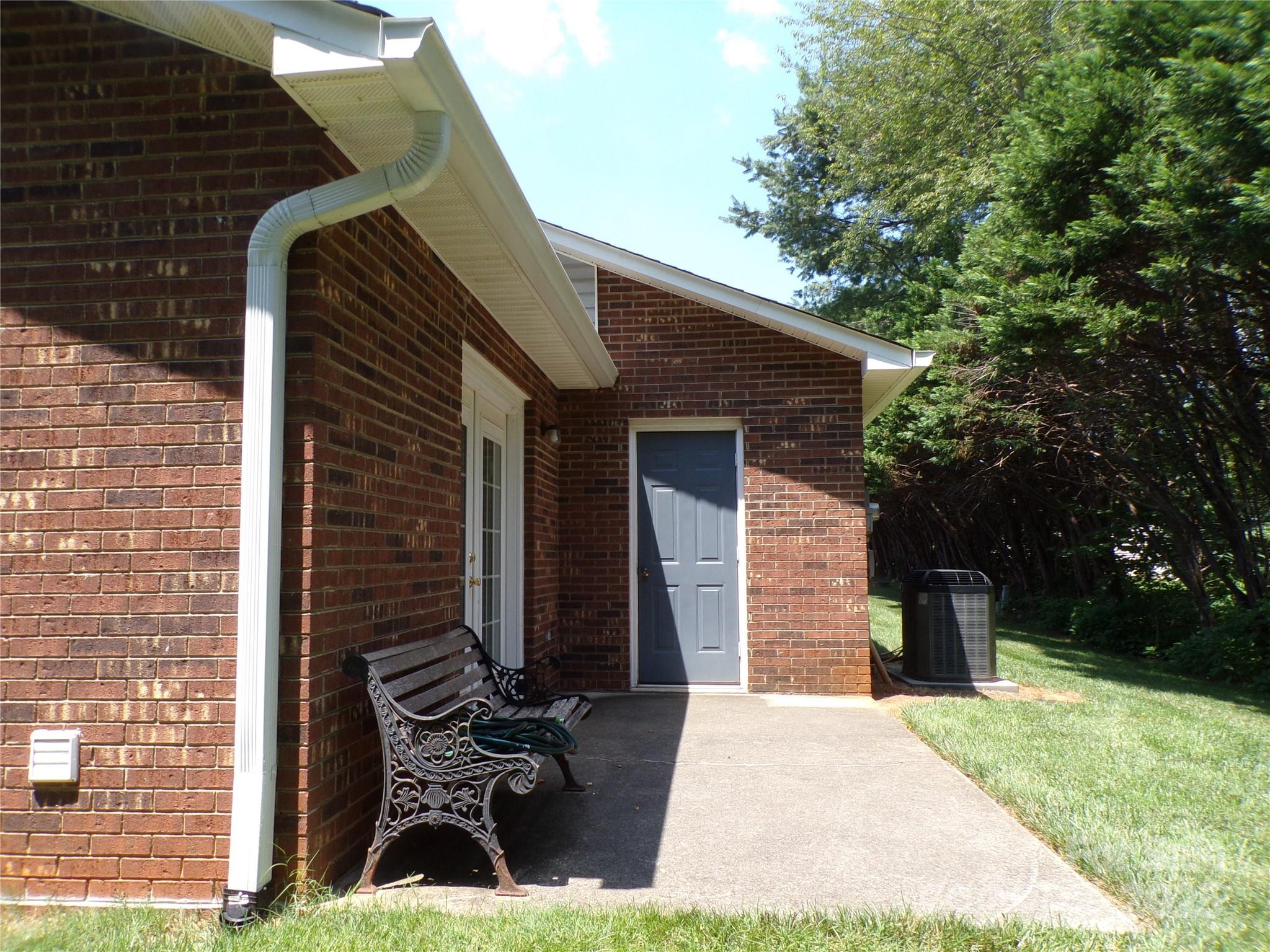 319 7th St Place Southwest, Unit E5 Conover, NC 28613 - Photo 5 of 15 a view of a brick house with a patio