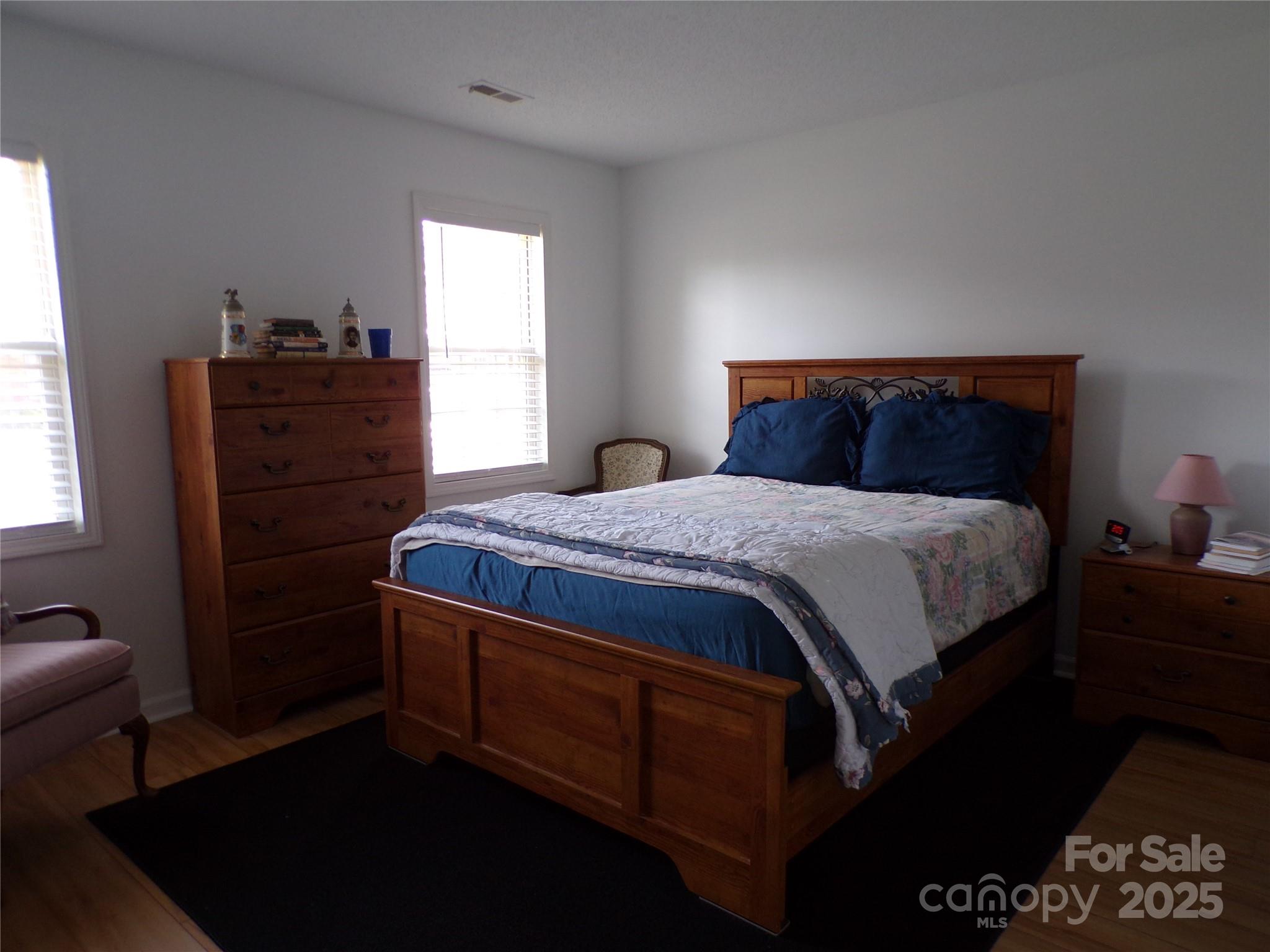 319 7th St Place Southwest, Unit E5 Conover, NC 28613 - Photo 10 of 15 a bedroom with a bed and dresser