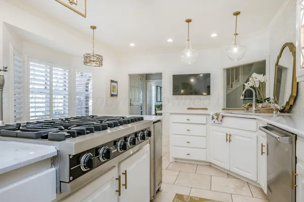 a kitchen with a stove and a sink