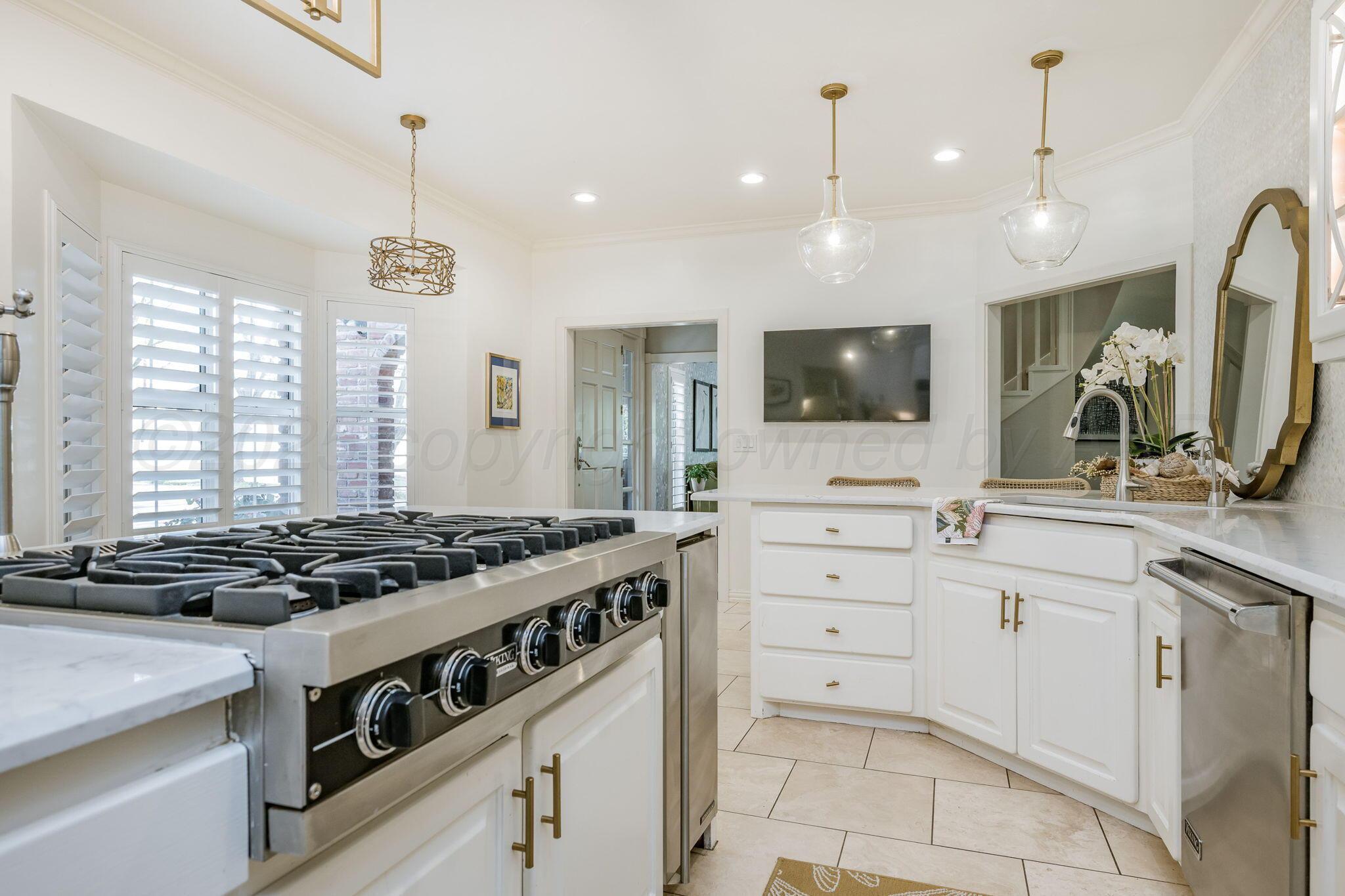 170 Dolphin Terrace Amarillo, TX 79118 - Photo 15 of 56 a kitchen with a stove and a sink