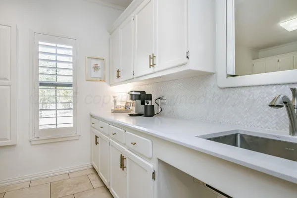 a kitchen with appliances cabinets and a window