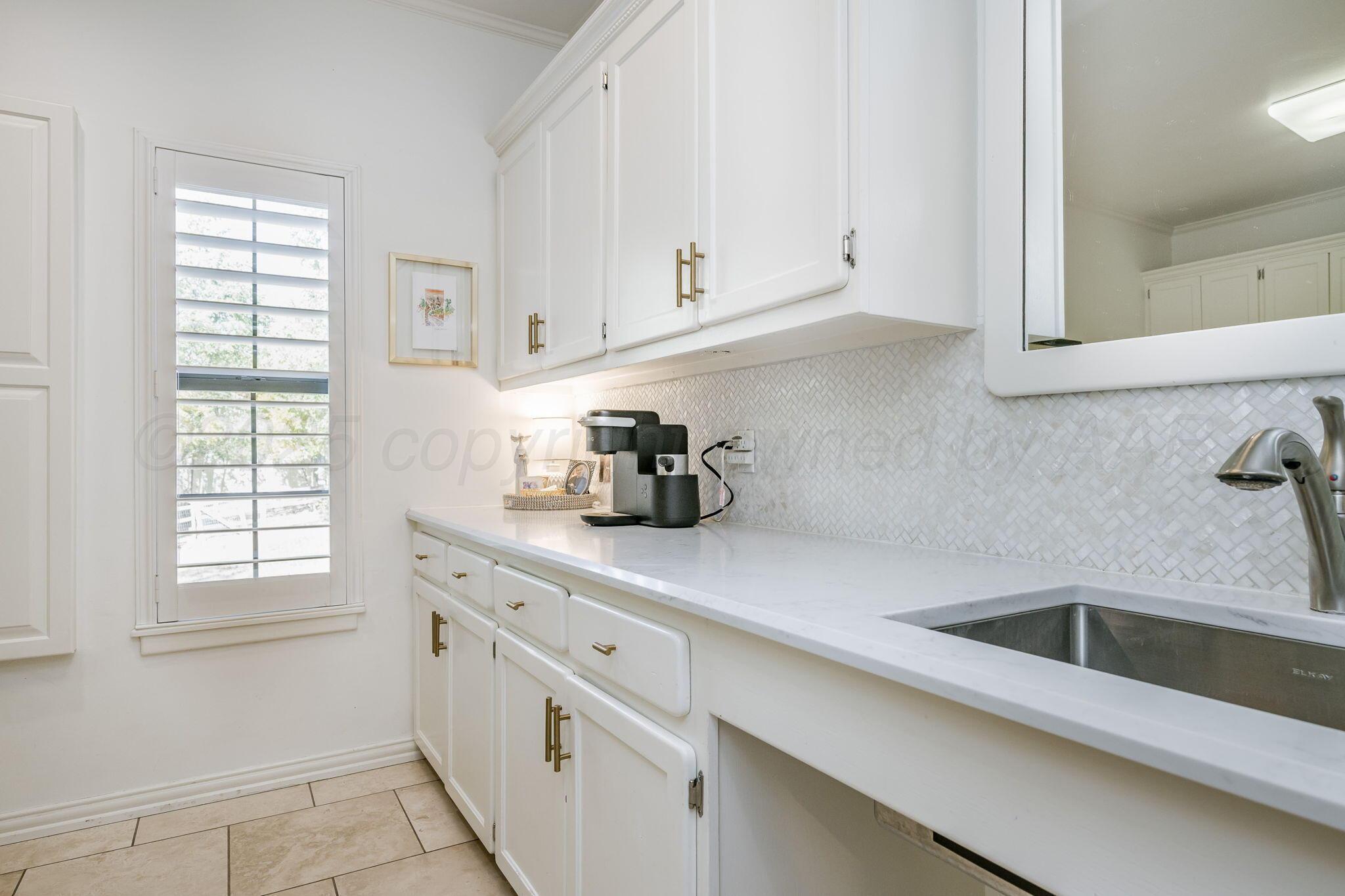 170 Dolphin Terrace Amarillo, TX 79118 - Photo 17 of 56 a kitchen with appliances cabinets and a window