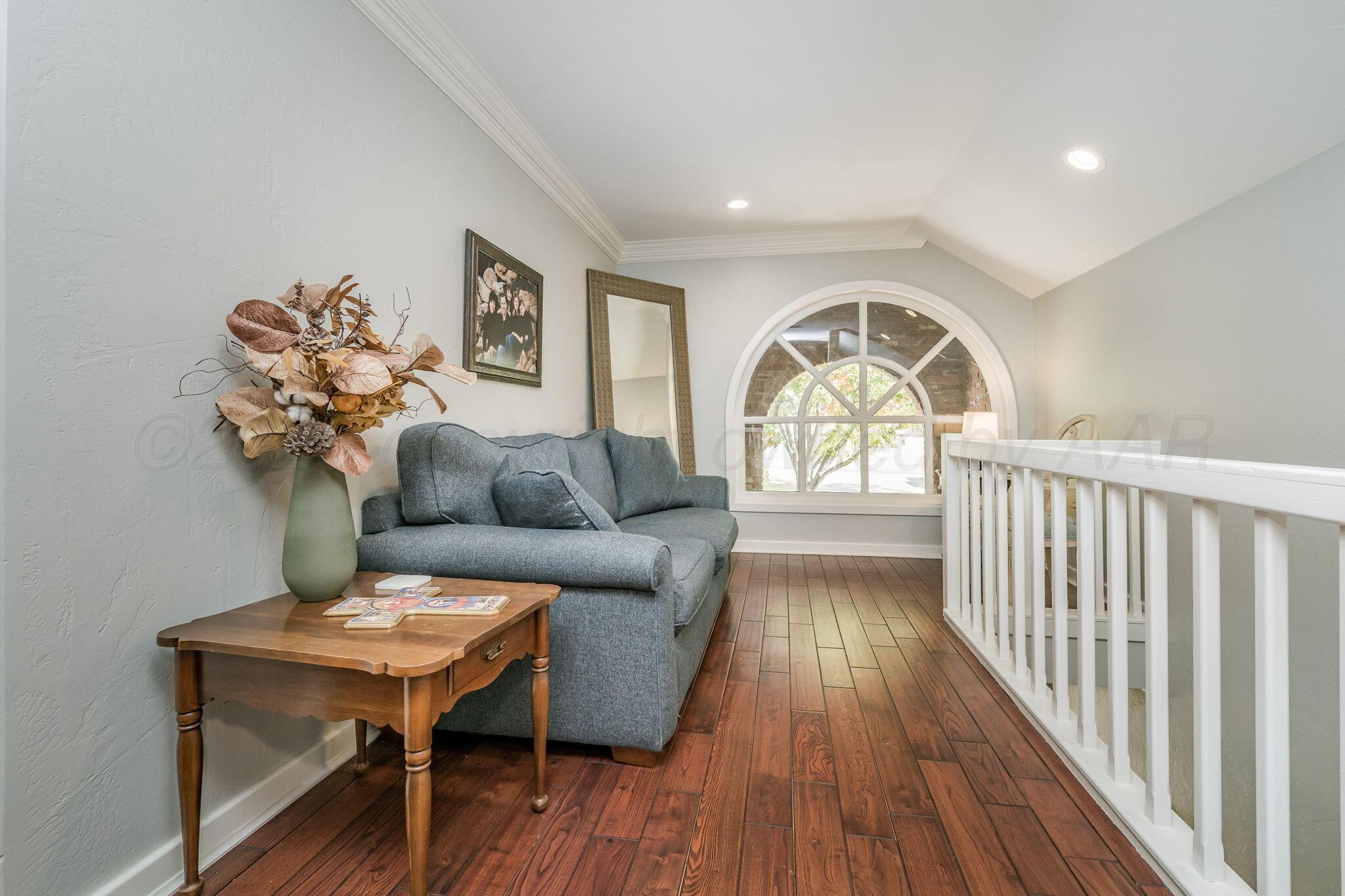 170 Dolphin Terrace Amarillo, TX 79118 - Photo 21 of 56 a living room with furniture and a large window